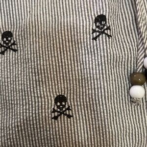 Sleeveless Pinstripe dress with dark blue skull embroidery detail